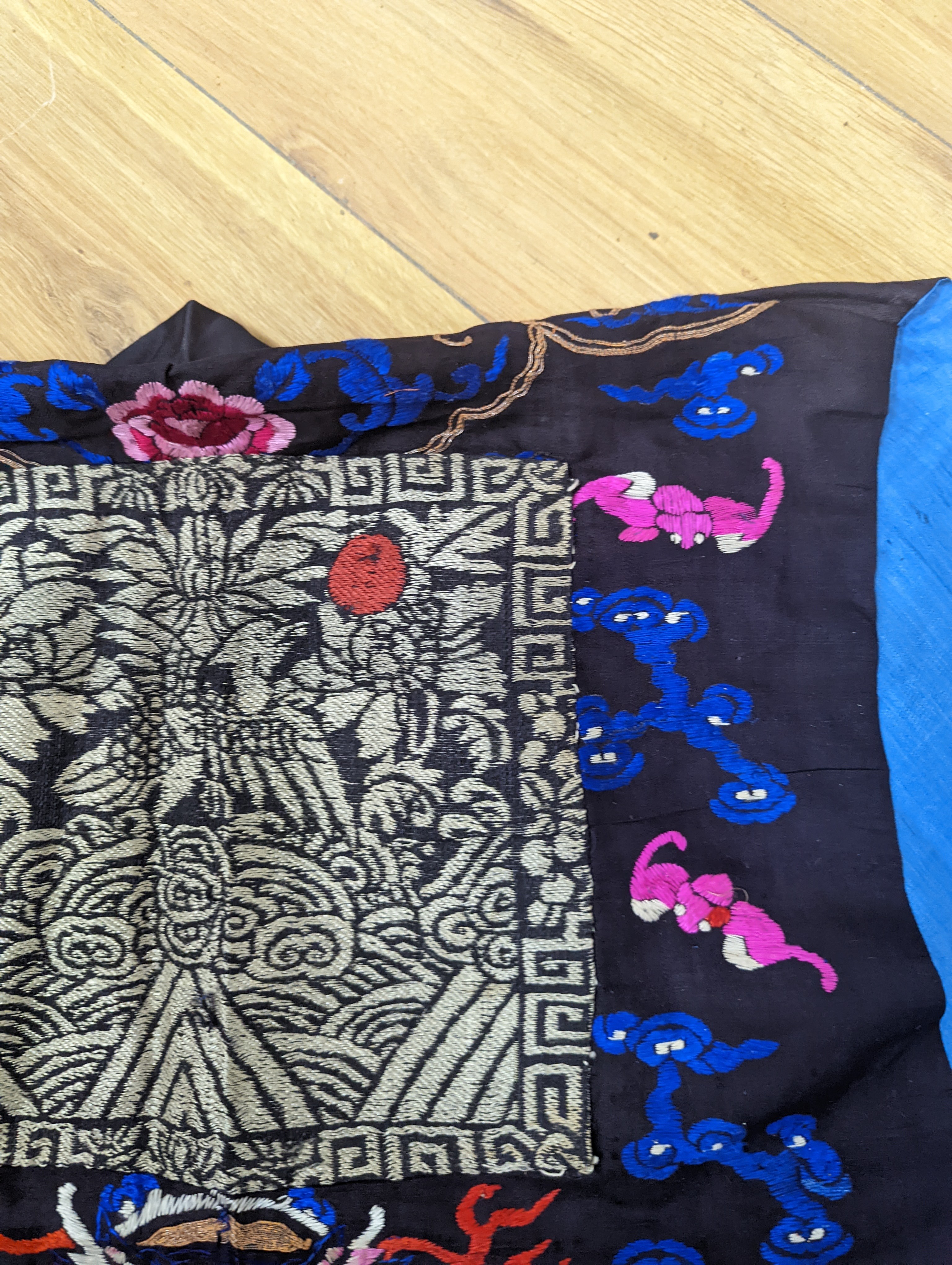 A 1920's Chinese dragon embroidered waistcoat, a cream silk drawn thread dress and a silk crepe black and patterned reversible kimono (3 items).